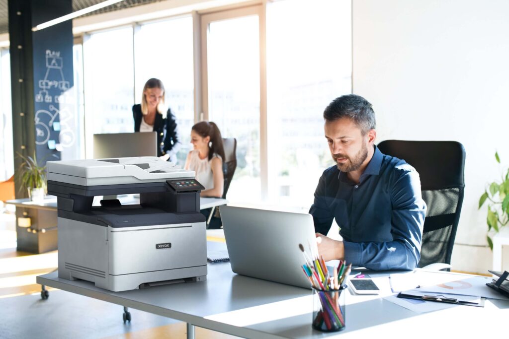 Managed IT Services - Business with Xerox Machine - Xerox Managed Print Services